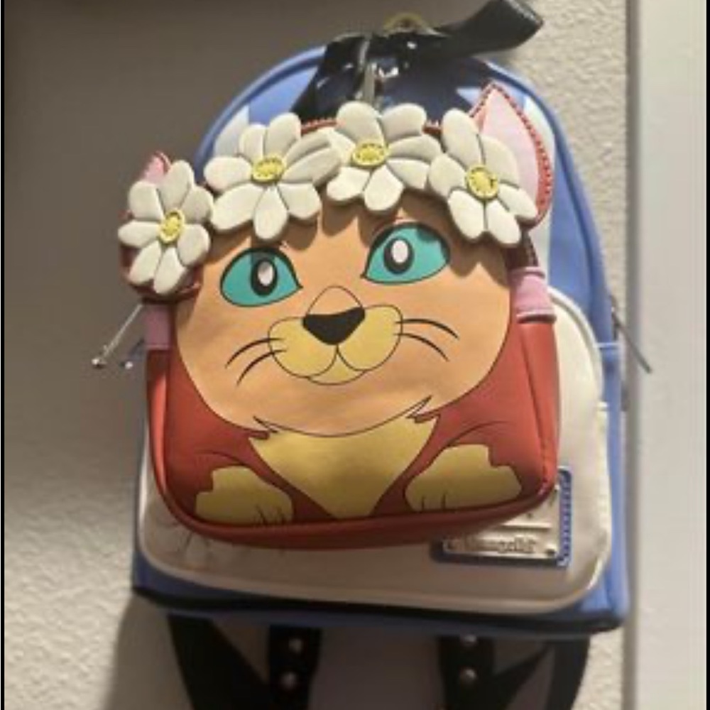 Loungefly alice in wonderland mini backpack.